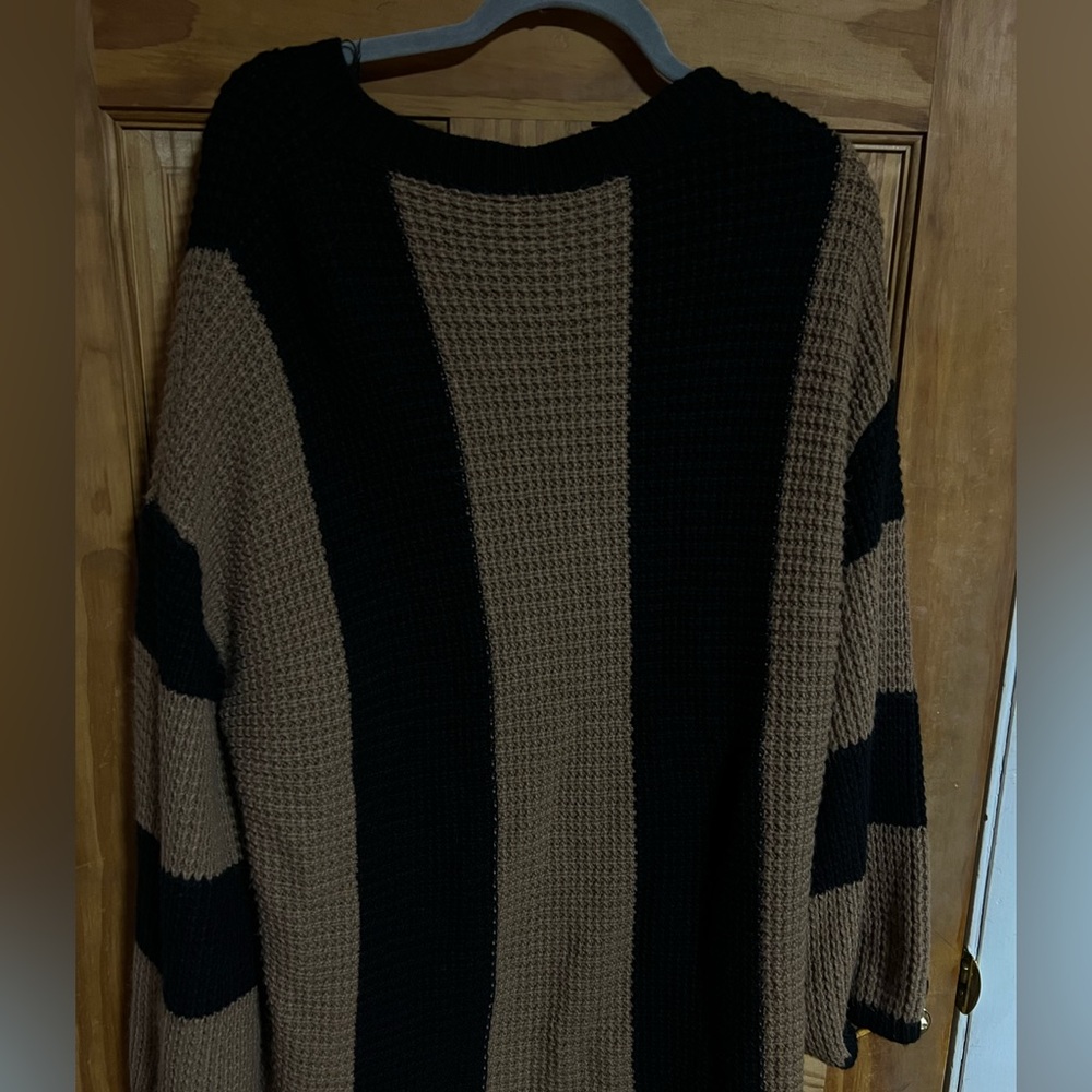 Oversized knit striped sweater with bell sleeves